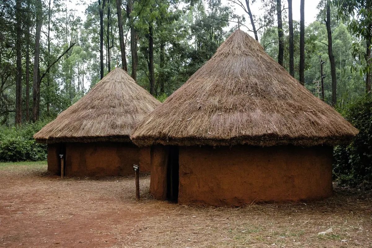Round thatched huts with clay walls in a traditional homestead at the Bomas