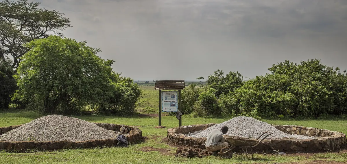 Stone-ringed burn sites on a lawn at the Ivory Burning Site