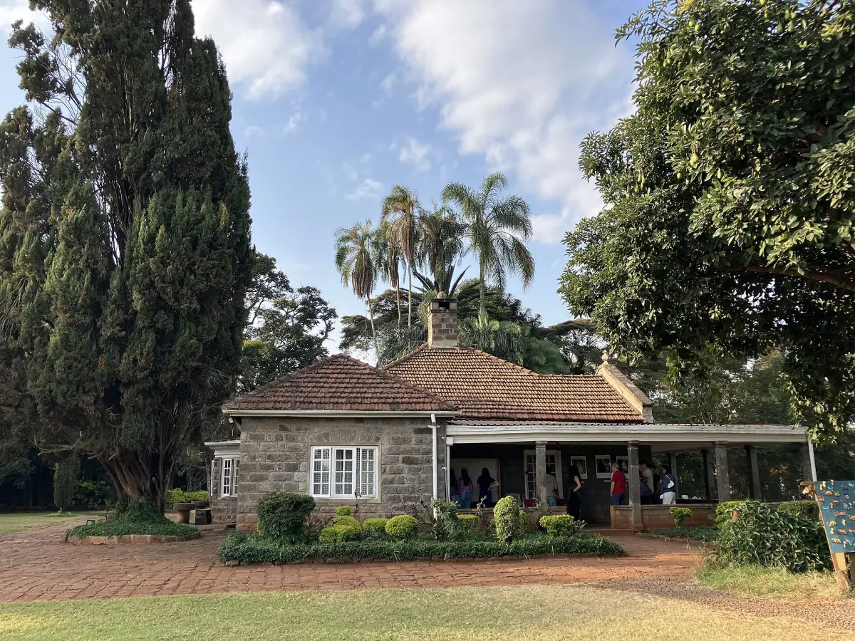 Stone farmhouse with tiled roof and veranda at the Karen Blixen Museum